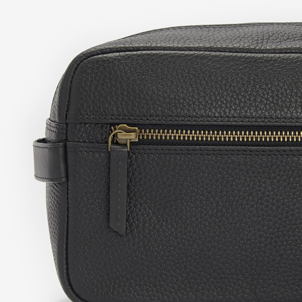 Barbour HIGHGATE LEATHER Mens Wash Bag Black side view showing zipper detail and leather texture.