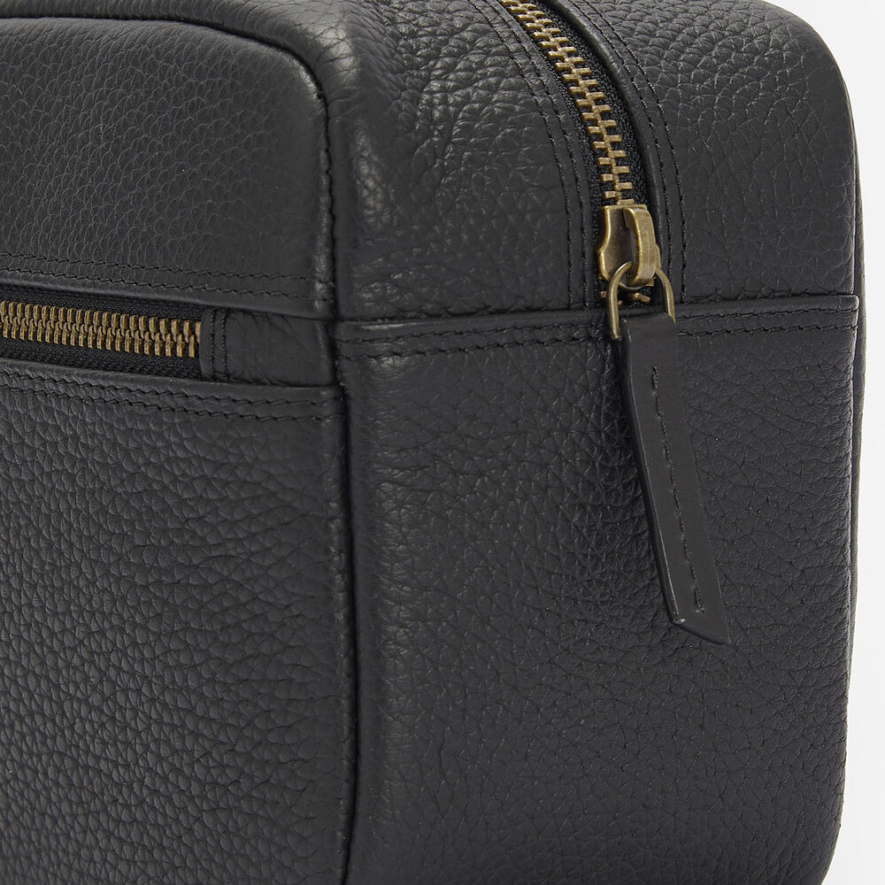Barbour HIGHGATE LEATHER Mens Wash Bag Black side view showcasing zip details and textured leather.