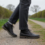 Barbour READHEAD Mens Boots Black side view on gravel path with model wearing grey trousers
