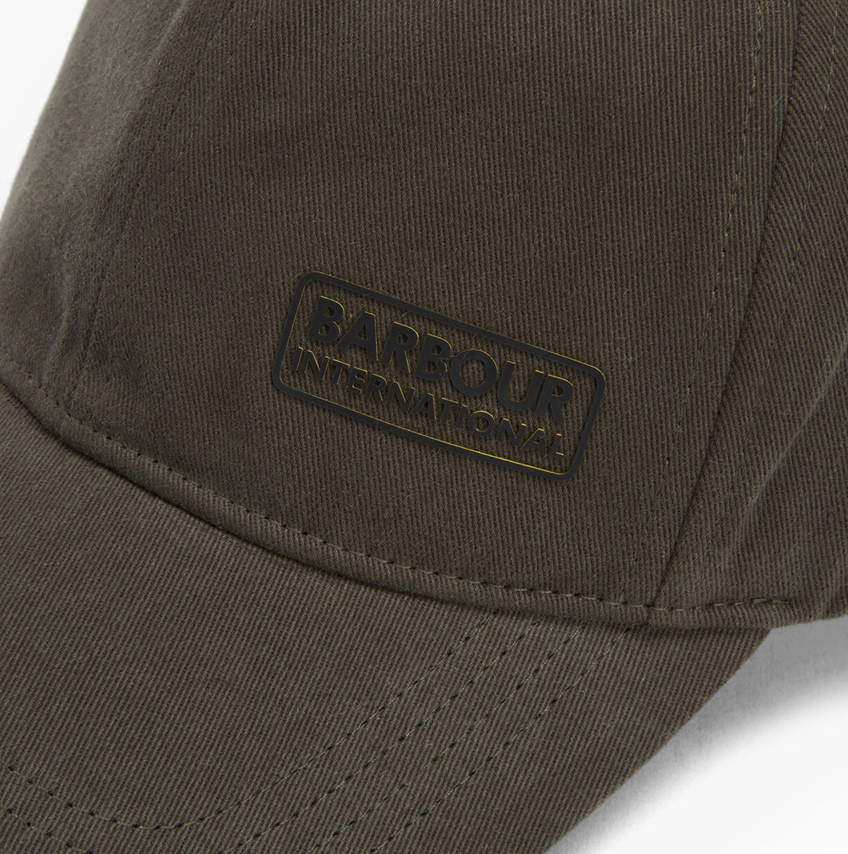 Barbour NORTON Drill Cap Mens Snapback Caps Sage/Shadow detail view of the cap logo and fabric texture.