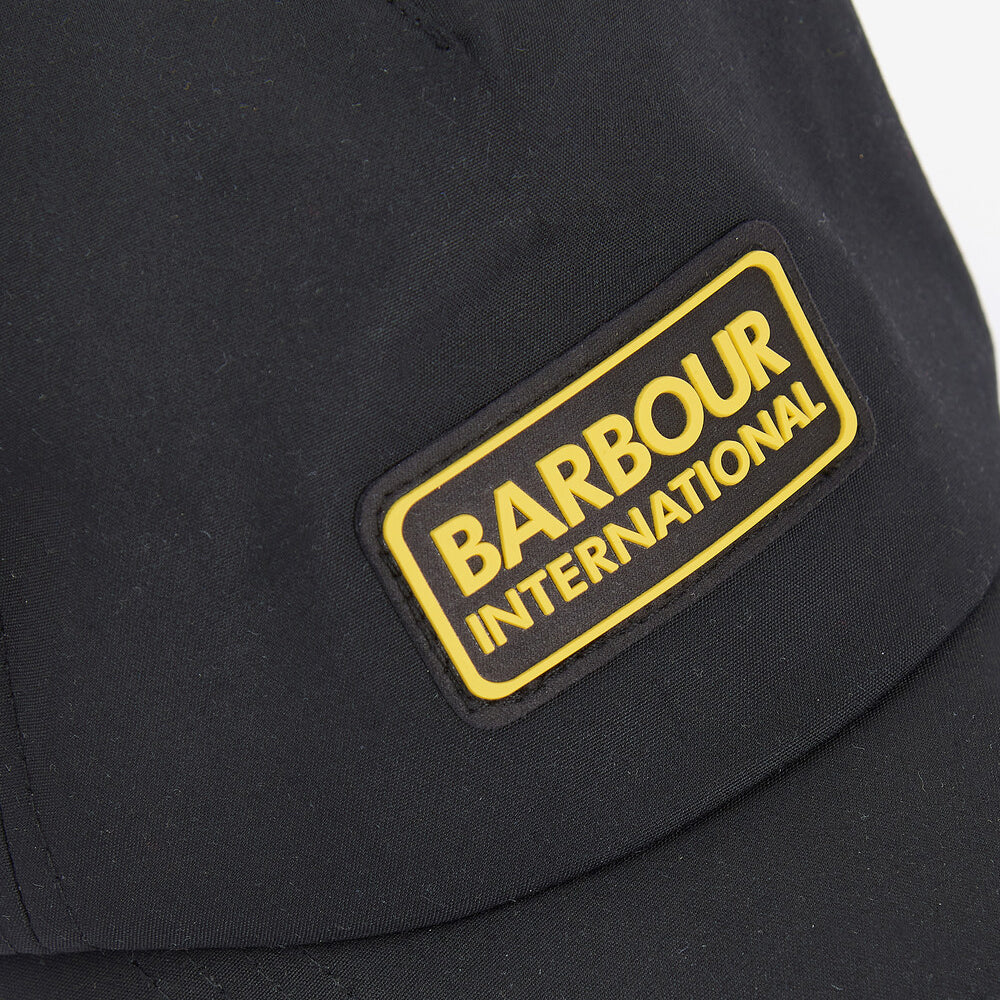 Barbour LEGACY WAXED COTTON Mens Sports Cap Black detail view showing logo patch on cap.