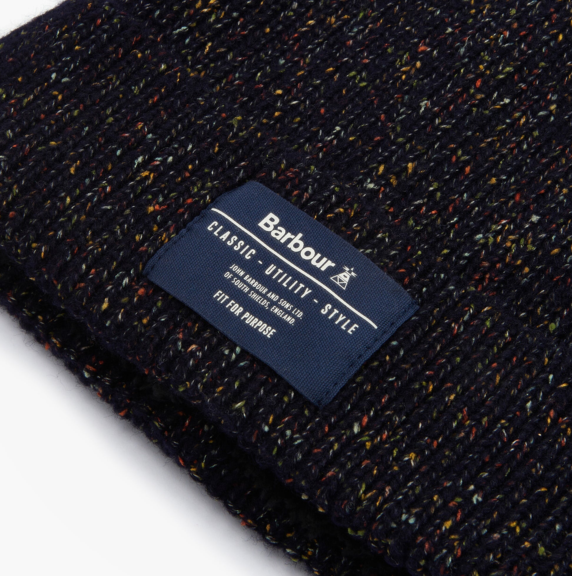 Barbour ESTON Mens Beanie Navy detail view featuring the label and textured fabric.