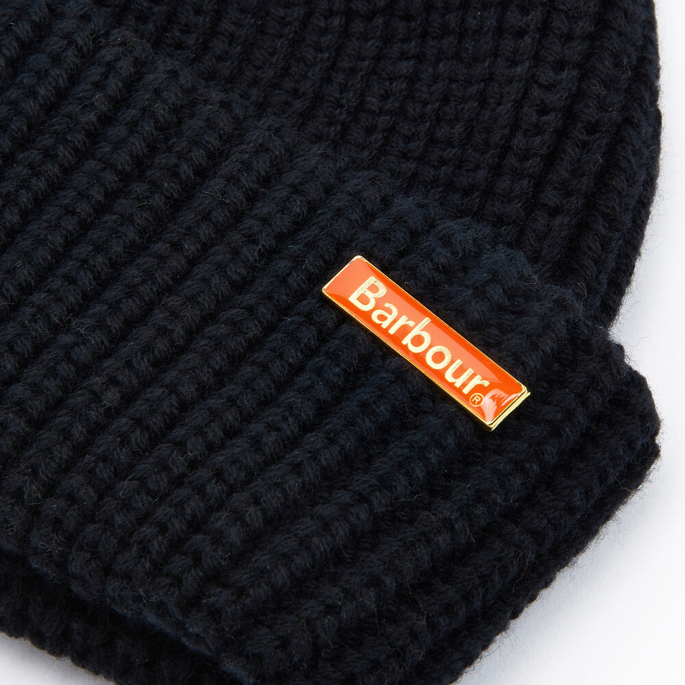 Barbour MOSELY Mens Fisherman Beanie Black detail view showing removable metal logo pin on cuff