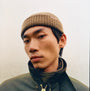 Barbour MOSELY Mens Fisherman Beanie Light Sage front view worn by a man with a neutral background.