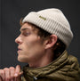 Barbour MOSELY Mens Beanie Mist side view on model, showcasing the stylish ribbed texture and logo detail.
