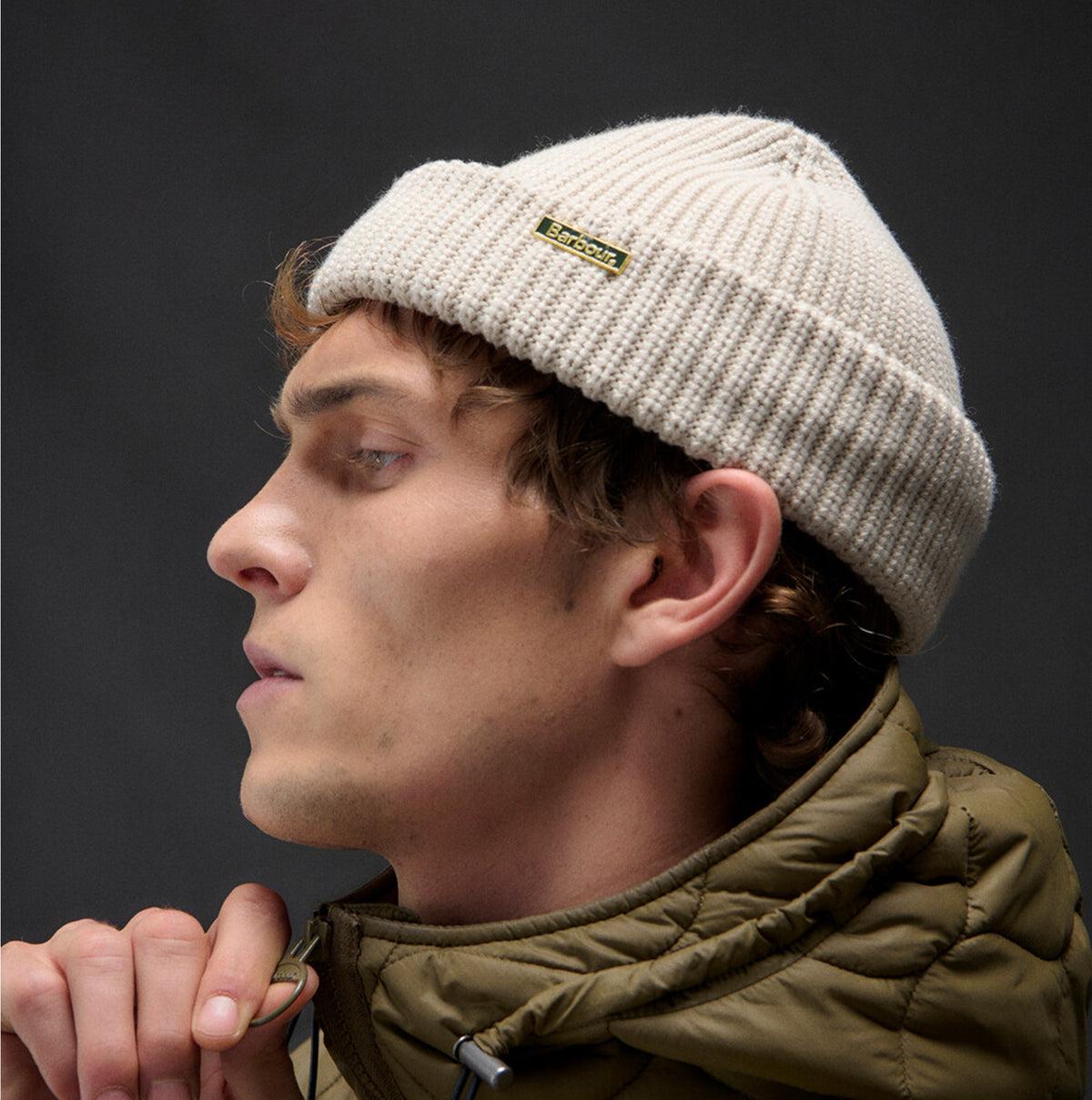 Barbour MOSELY Mens Beanie Mist side view on model, showcasing the stylish ribbed texture and logo detail.