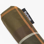 Barbour TARTAN MINI Classic Umbrella detail view showing the folded canopy with woven Barbour label.