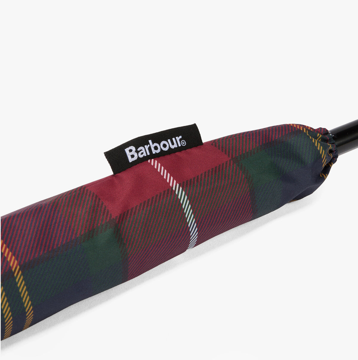 Barbour Tartan Walker Umbrella detail view of the canopy sleeve with woven Barbour side flag label.