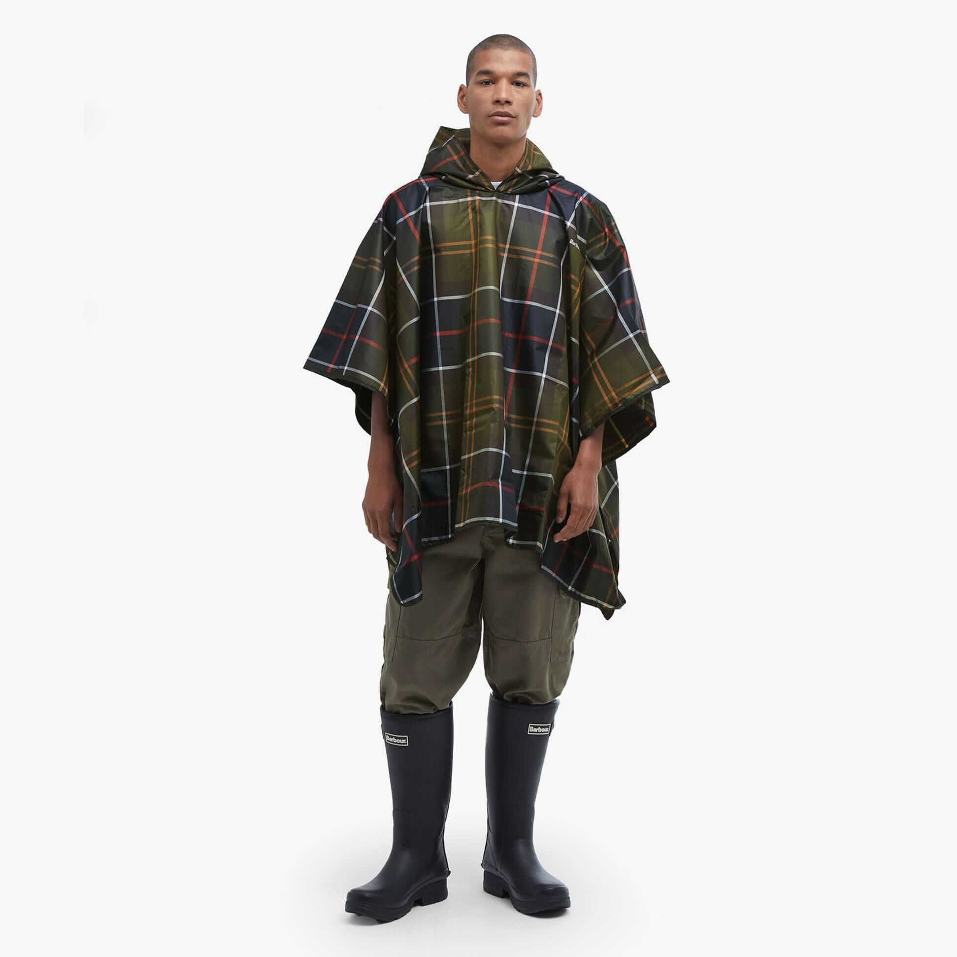 Barbour Mens TARTAN SHOWERPROOF PONCHO Classic Tartan front view, featuring a model in a waterproof poncho.