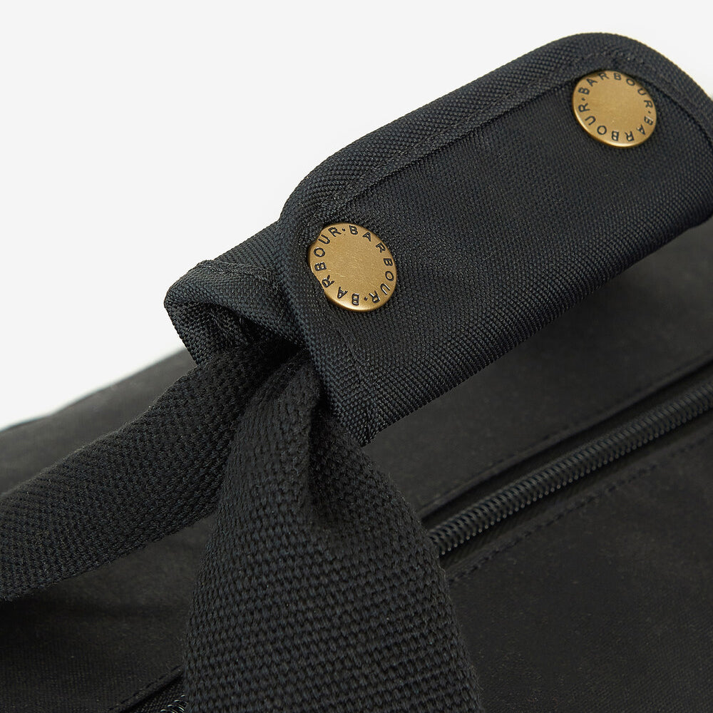 Barbour EXPLORER WAX Unisex Adults Duffle Bag Black detail view of webbed grab handle and zipper.