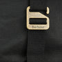 Close-up detail view of the fastening on the Barbour ESSENTIAL WAX BACKPACK Unisex Adults Backpack Black.