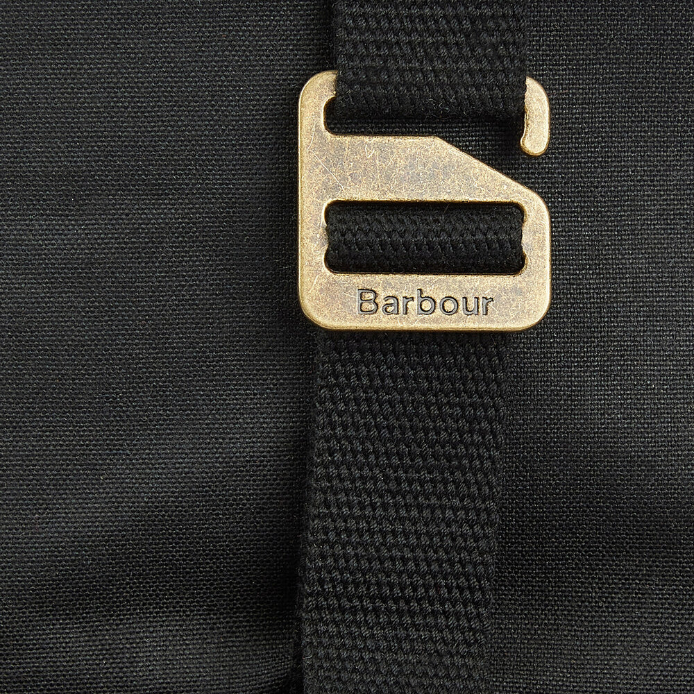 Close-up detail view of the fastening on the Barbour ESSENTIAL WAX BACKPACK Unisex Adults Backpack Black.