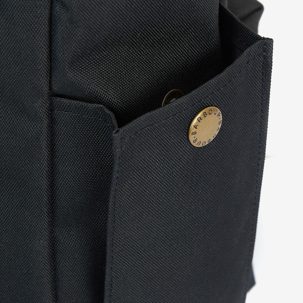 Barbour ESSENTIAL WAX BACKPACK Unisex Adults Backpack Black detail view of outer pocket and embossed badge