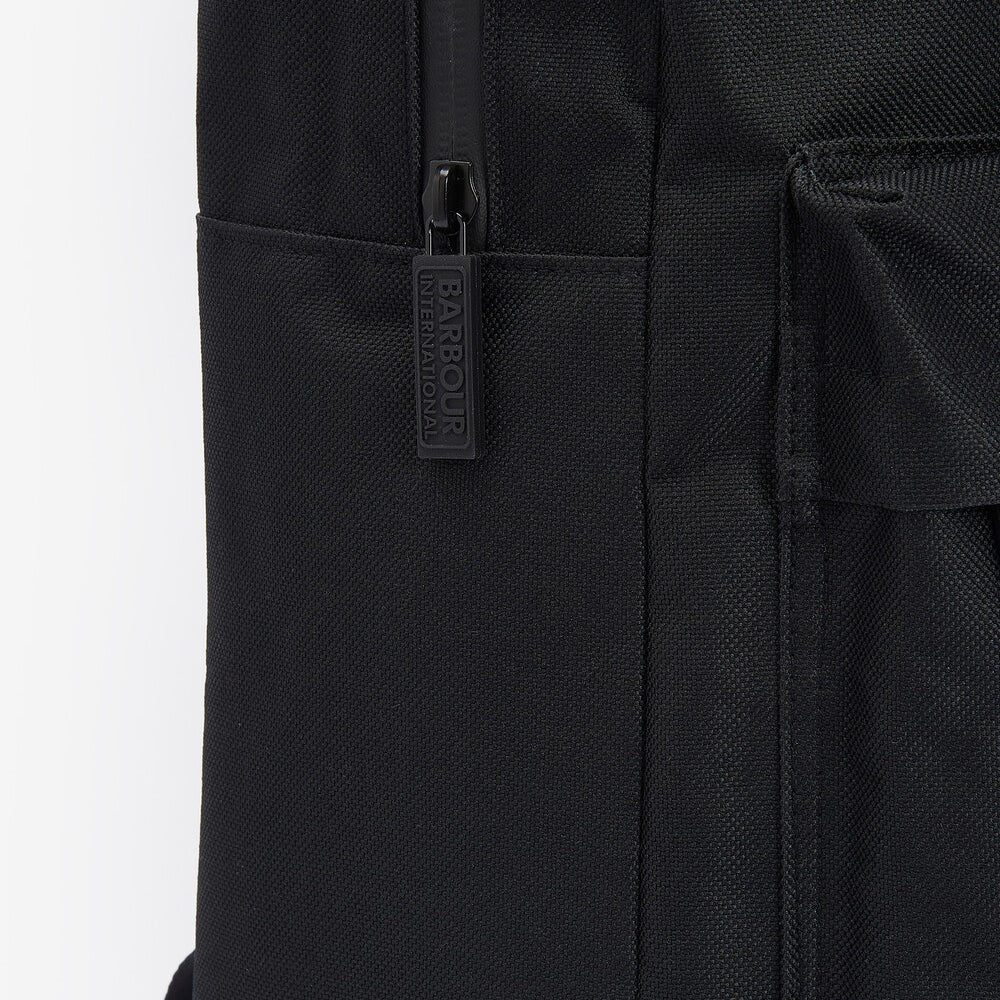 Detail view of the Barbour KNOCKHILL ESSENTIAL BACKPACK Unisex Adults Backpack Black showing zipper and branding.