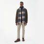 Barbour NEW CHECK Unisex Adults Tartan Scarf Sand Beige Plaid front view worn by a man, showcasing its all-over checked pattern.