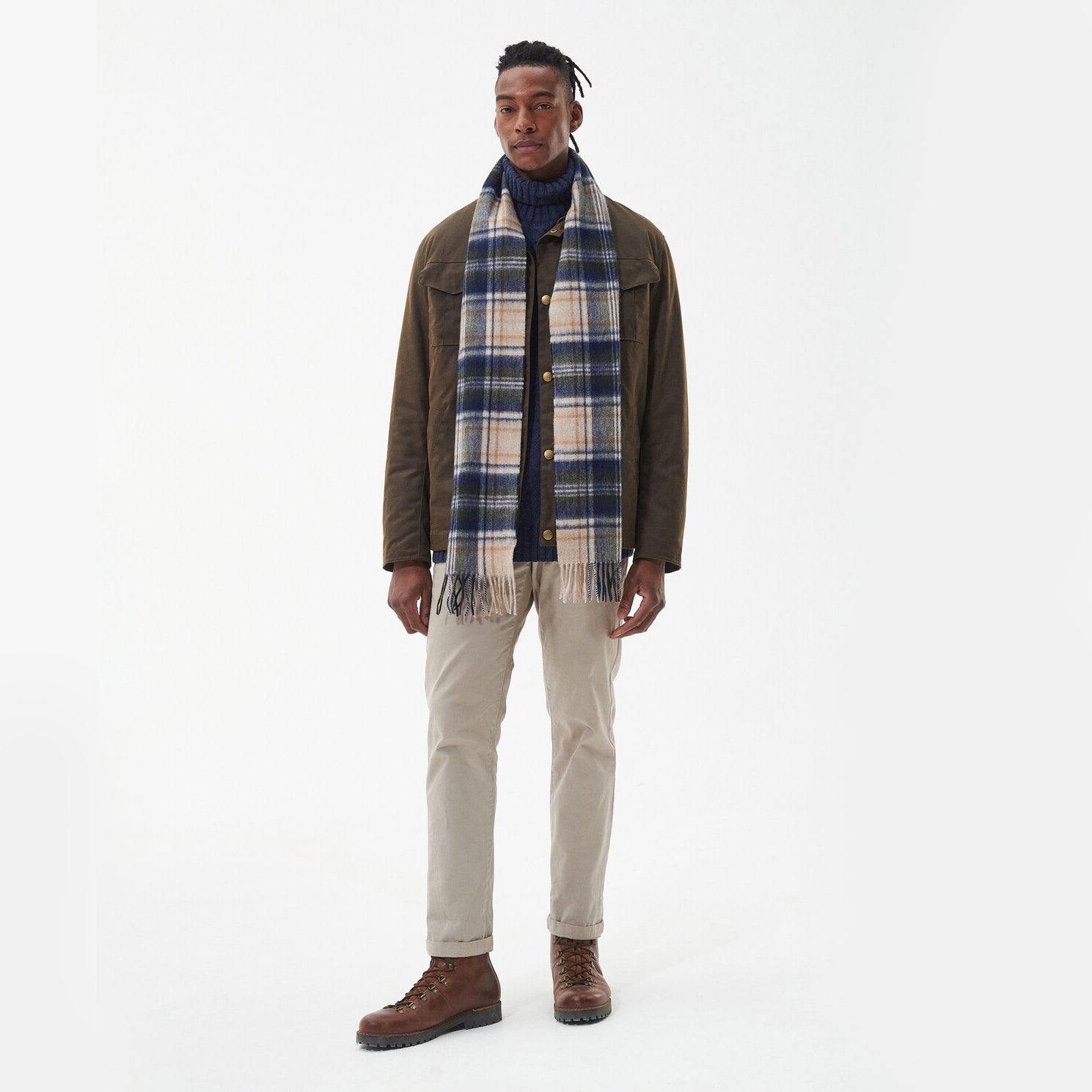 Barbour NEW CHECK Unisex Adults Tartan Scarf Sand Beige Plaid front view worn by a man, showcasing its all-over checked pattern.