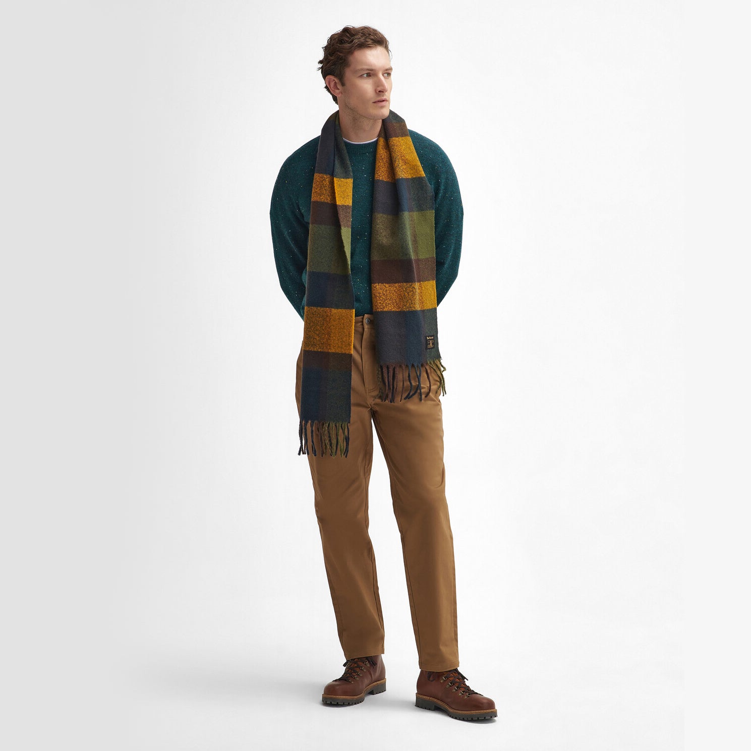 Barbour WESTERDALE Scarf Unisex Adults Classic front view on model wearing a green sweater and brown trousers.