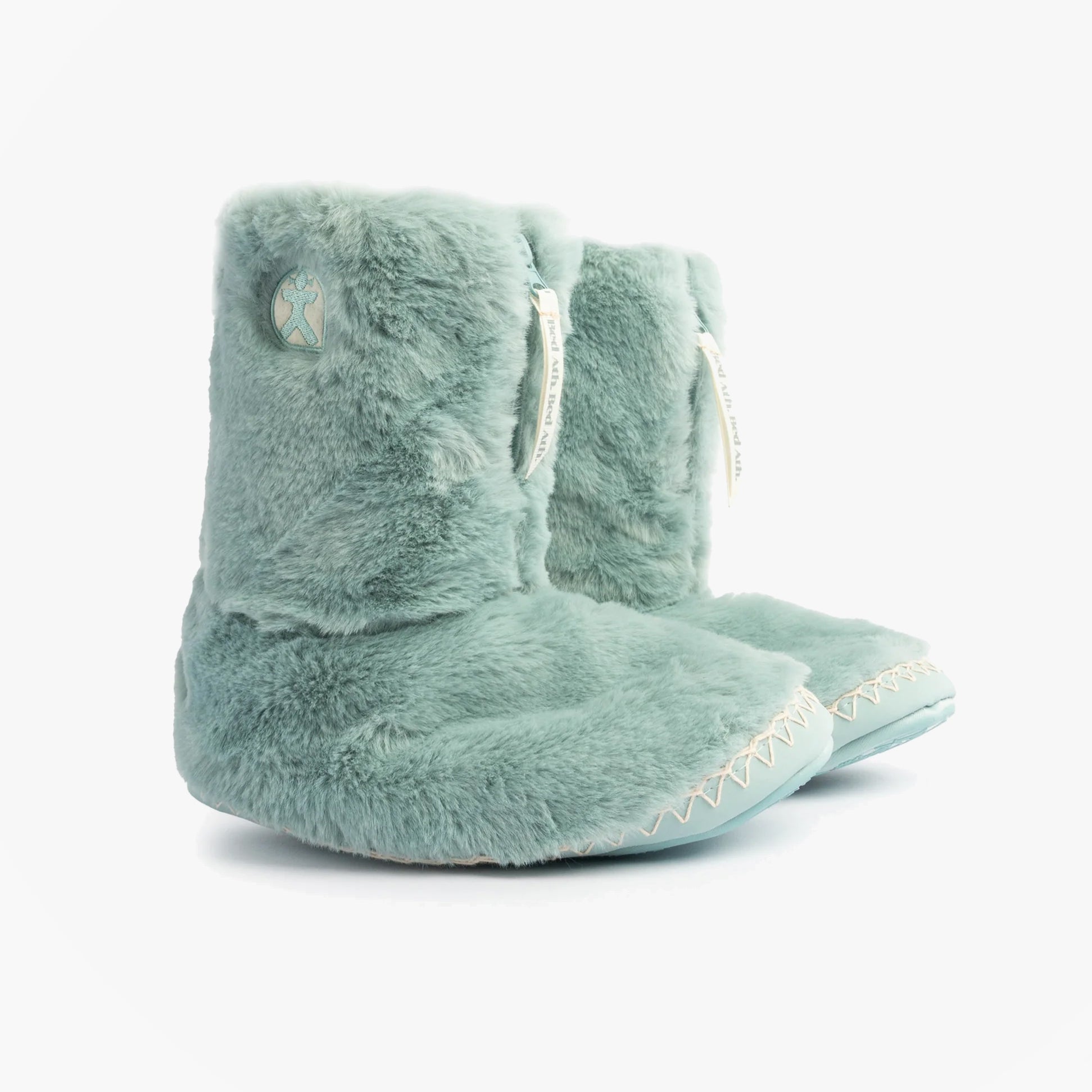 Bedroom Athletics MARILYN Womens Faux Fur Boots Seafoam side view showcasing soft faux fur and relaxed fit.