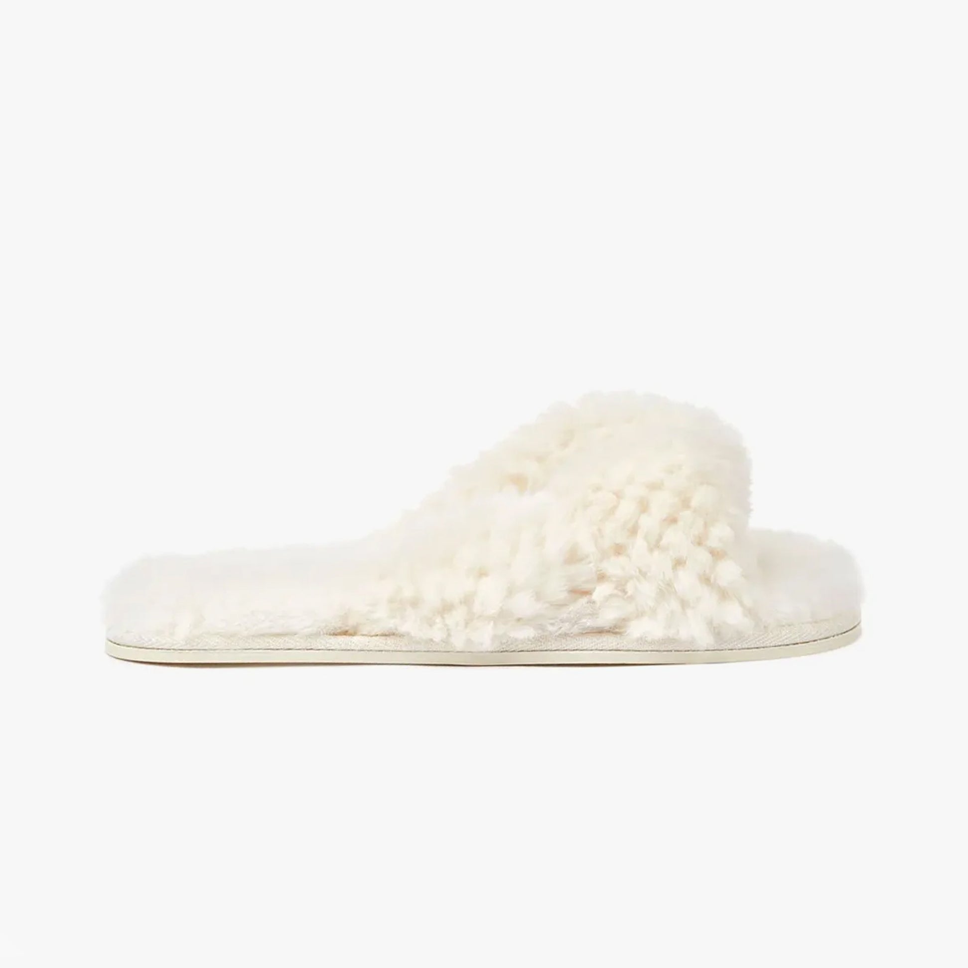 Bedroom Athletics NICKI Womens Faux Fur Slipper Sliders Cream side view showcasing soft faux fur upper and flat sole.