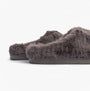 Bedroom Athletics ARIANA Womens Mule Slippers Ink side view showing faux fur upper and flat sole.