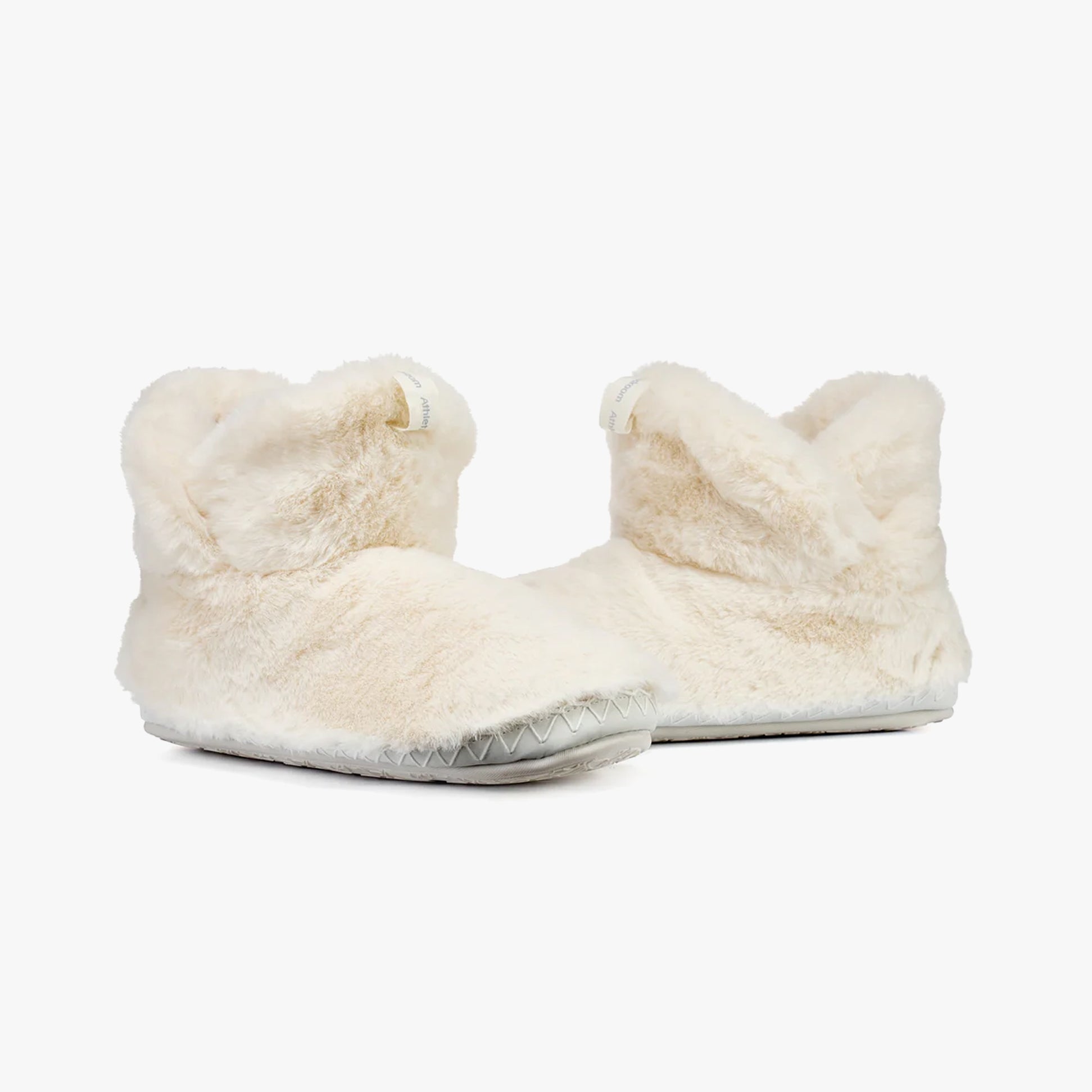 Bedroom Athletics HARRIET Womens Slipper Boots Cream side view showing faux fur upper and round toe design.