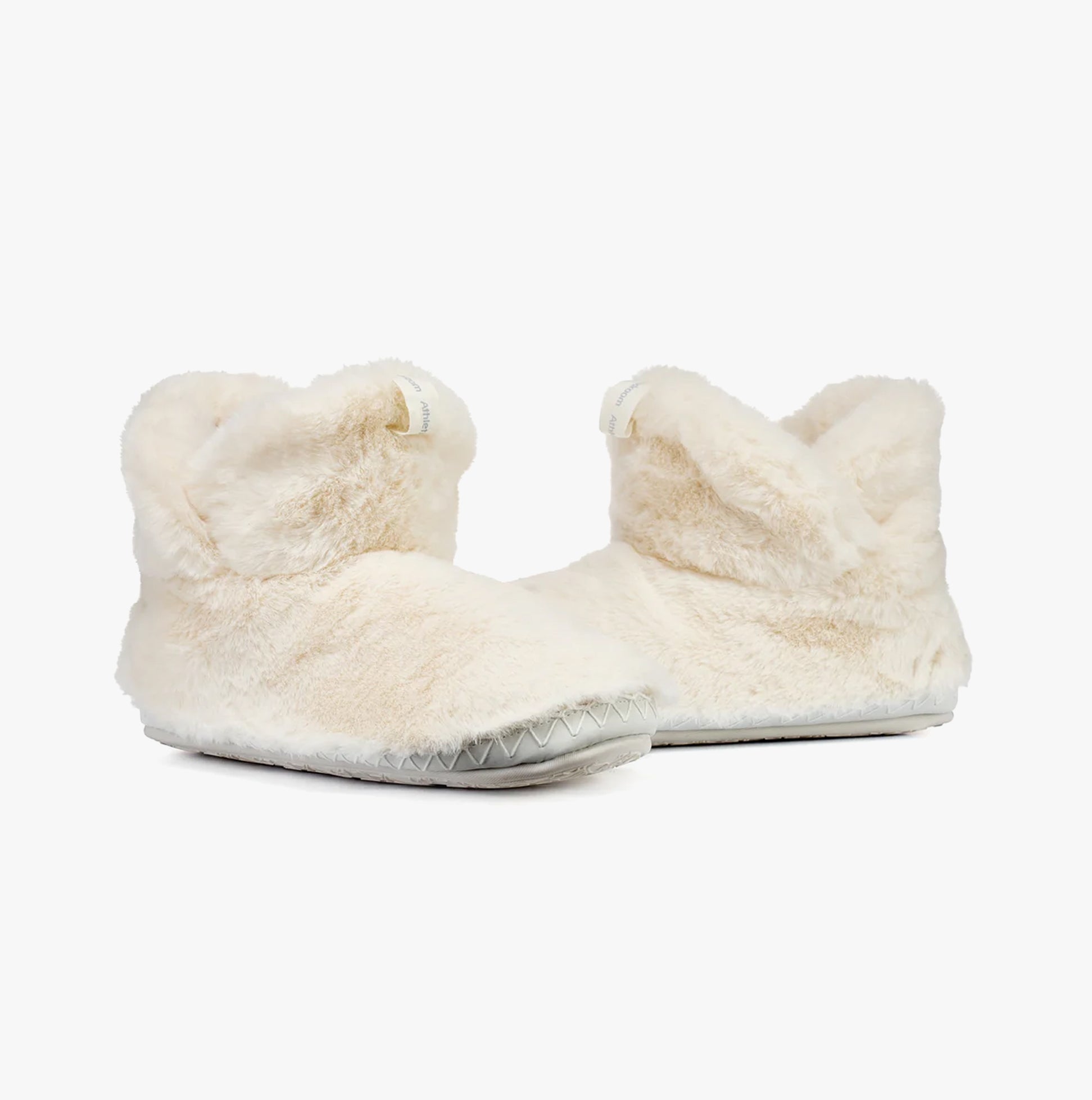 Bedroom Athletics HARRIET Womens Slipper Boots Cream side view showing faux fur upper and round toe design.