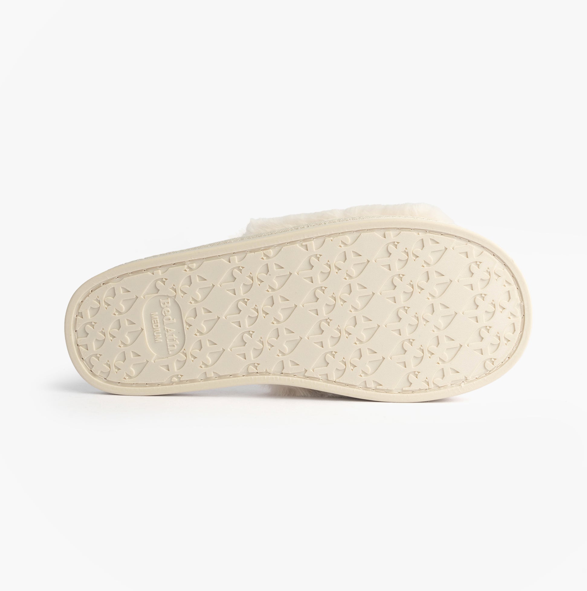 Bedroom Athletics ERIN Womens Slipper Sliders Cream bottom view showing rubber sole with detailed pattern.