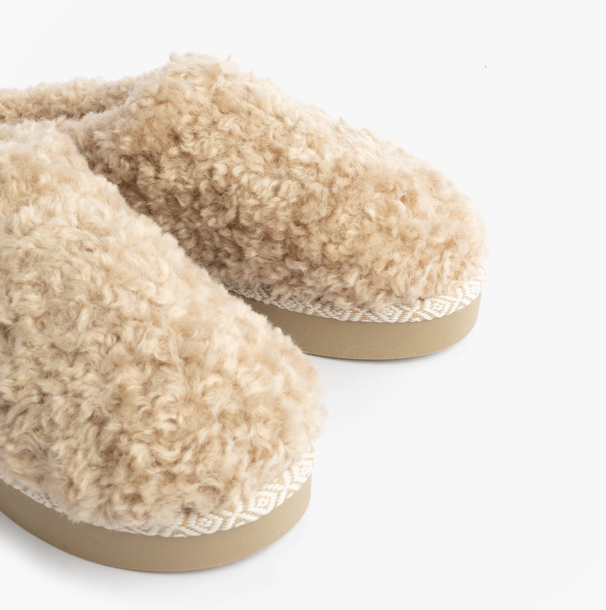Bedroom Athletics ALICIA Womens Mule Slippers Biscuit close-up side view showcasing faux fur upper and slip-on design.