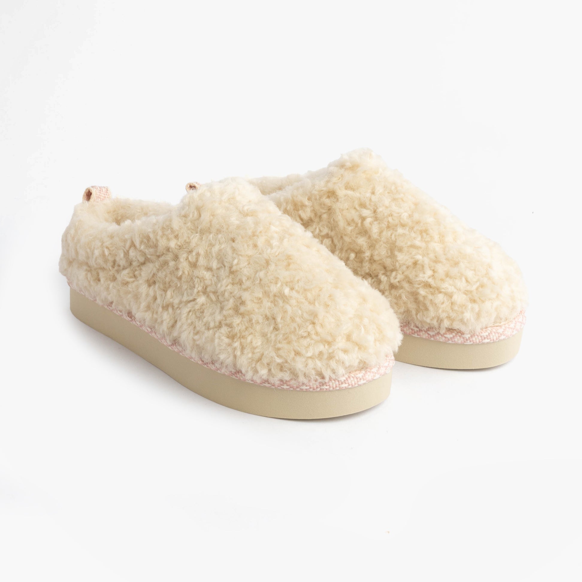 Bedroom Athletics ALICIA Womens Mule Slippers Cream side view faux fur upper and rubber sole.