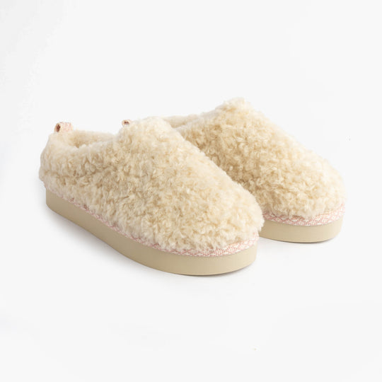 Bedroom Athletics ALICIA Womens Mule Slippers Cream side view faux fur upper and rubber sole.
