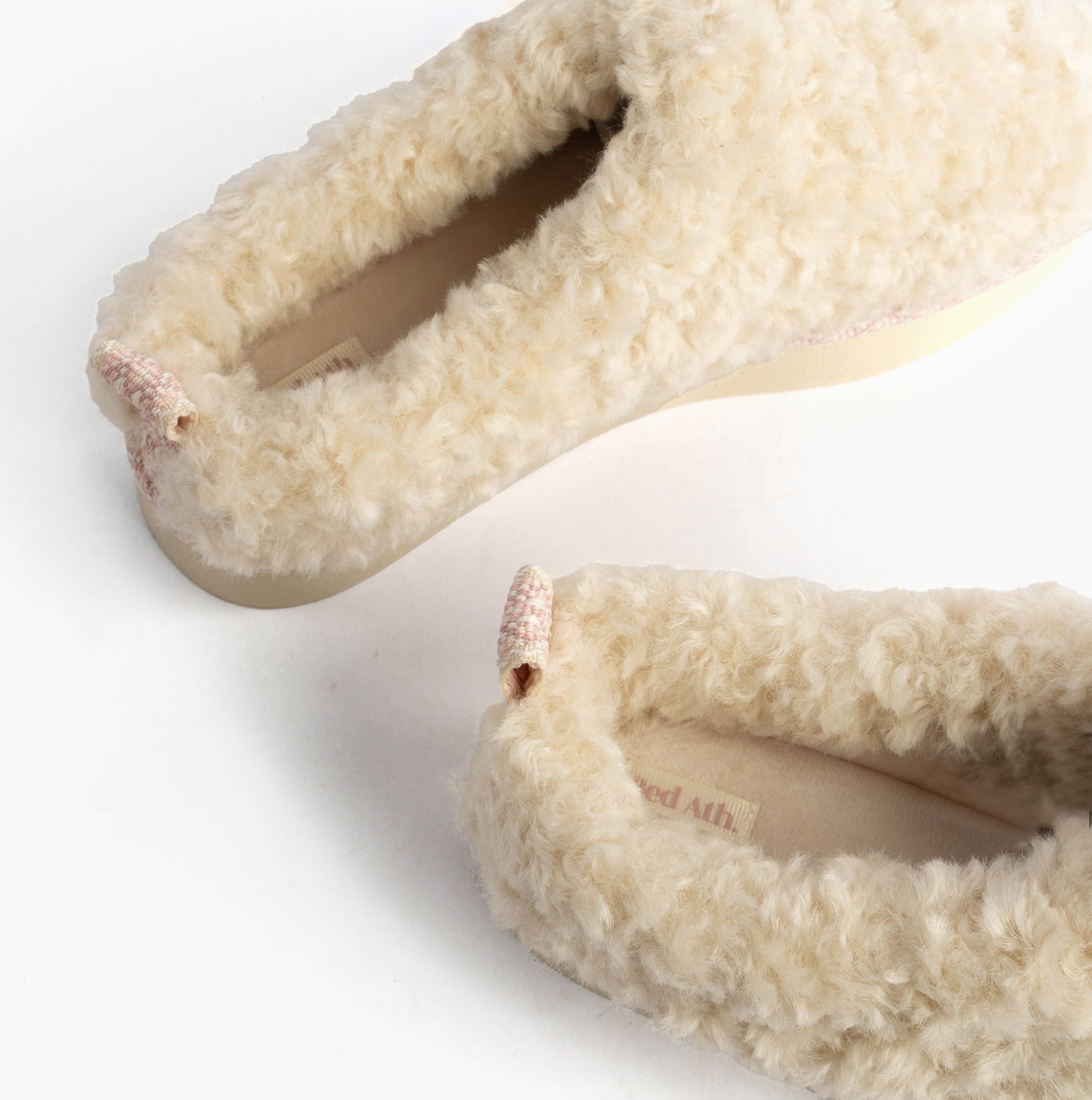 Bedroom Athletics ALICIA Womens Mule Slippers Cream top view showcasing faux fur material and slip-on design.