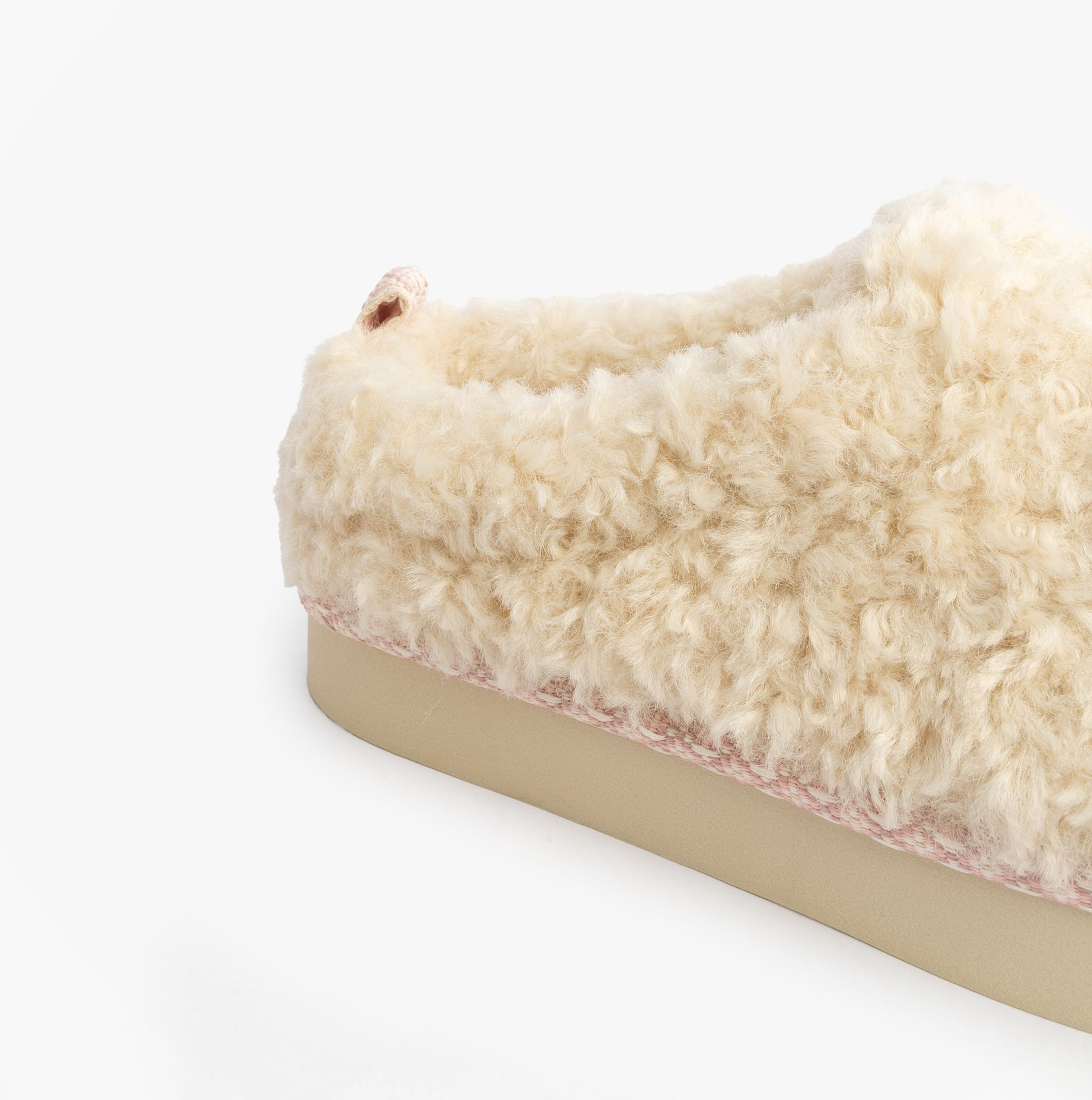 Bedroom Athletics ALICIA Womens Mule Slippers Cream side view showcasing faux fur upper and rubber sole.