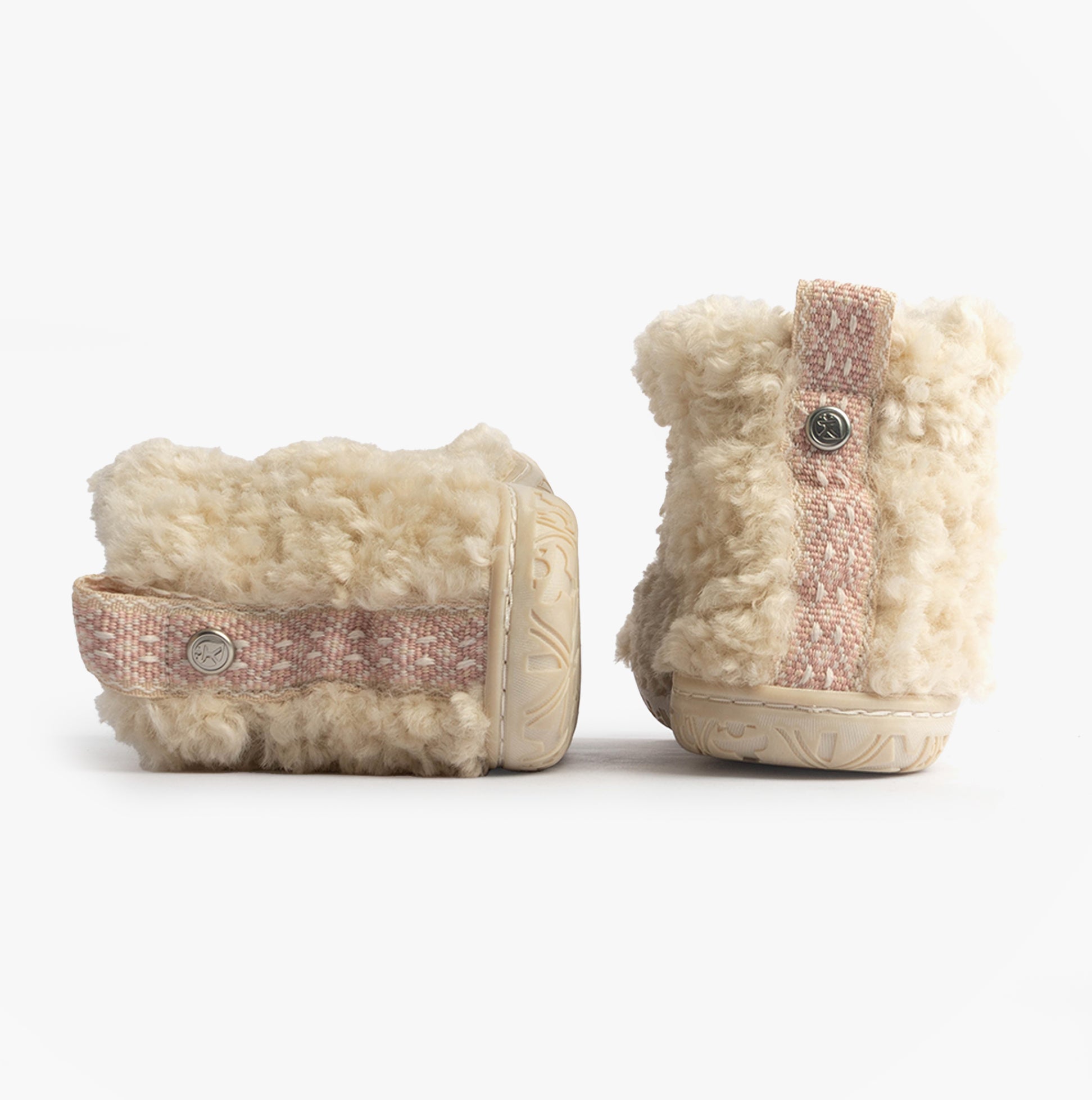 Bedroom Athletics LAUREN Womens Slipper Boots Cream side view showcasing faux fur upper and pink strap detail.