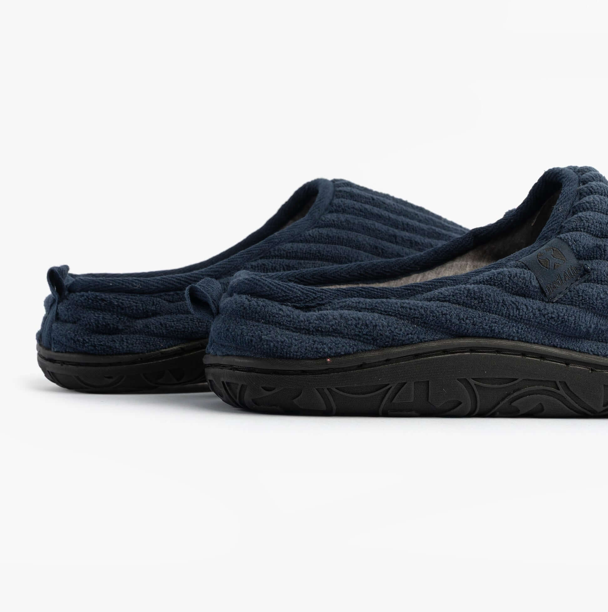 Bedroom Athletics JAMIE Mens Mule Slippers Navy side view showcasing textile upper and rubber sole.