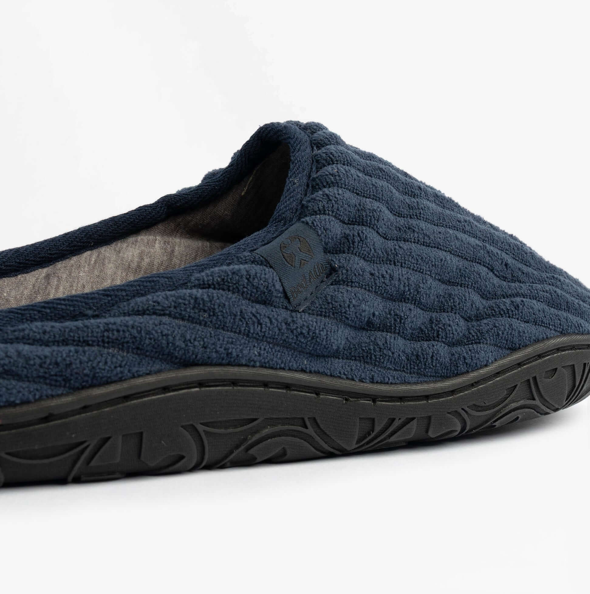Bedroom Athletics JAMIE Mens Mule Slippers Navy side view showing textured textile upper and rubber sole.