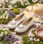 Boulevard L516G Ladies Shoes White side view in a floral garden setting with hat and basket.