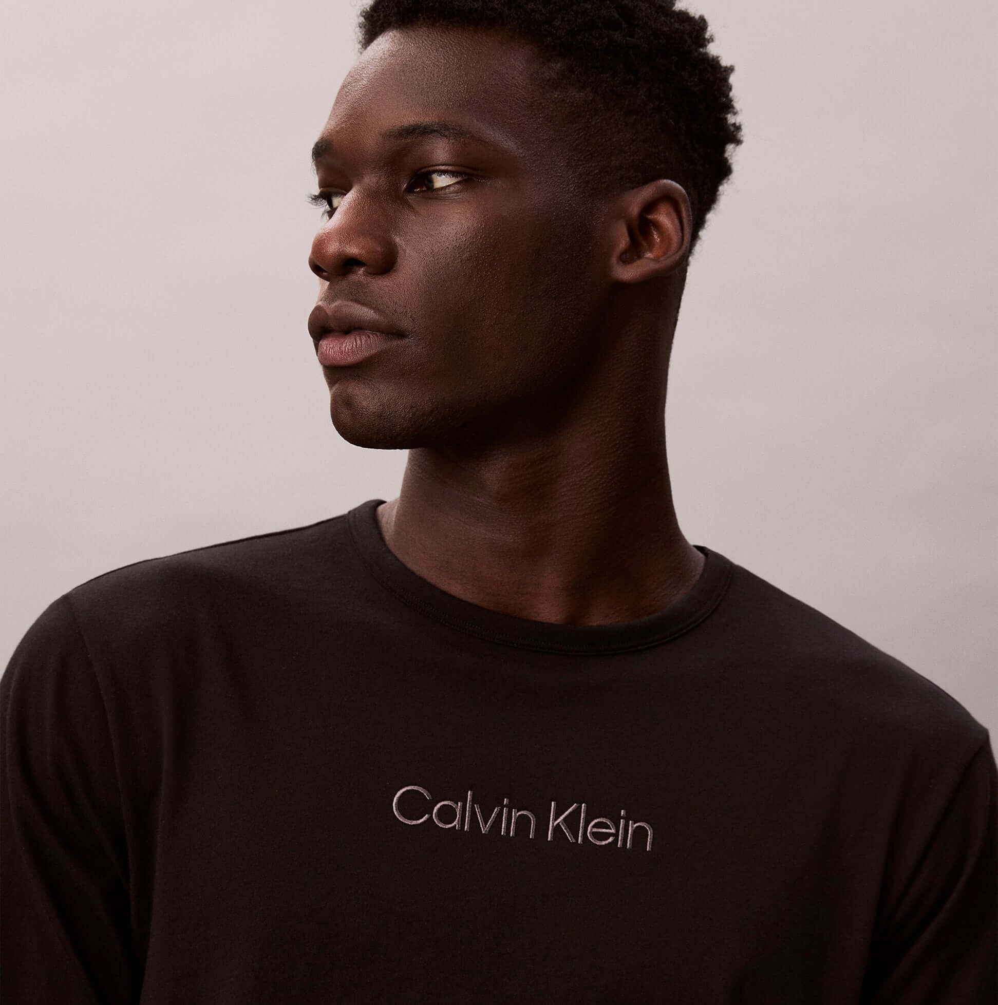 Calvin Klein LS TEE JOGGER SET Mens Multicoloured front view with model highlighting the logo detail.