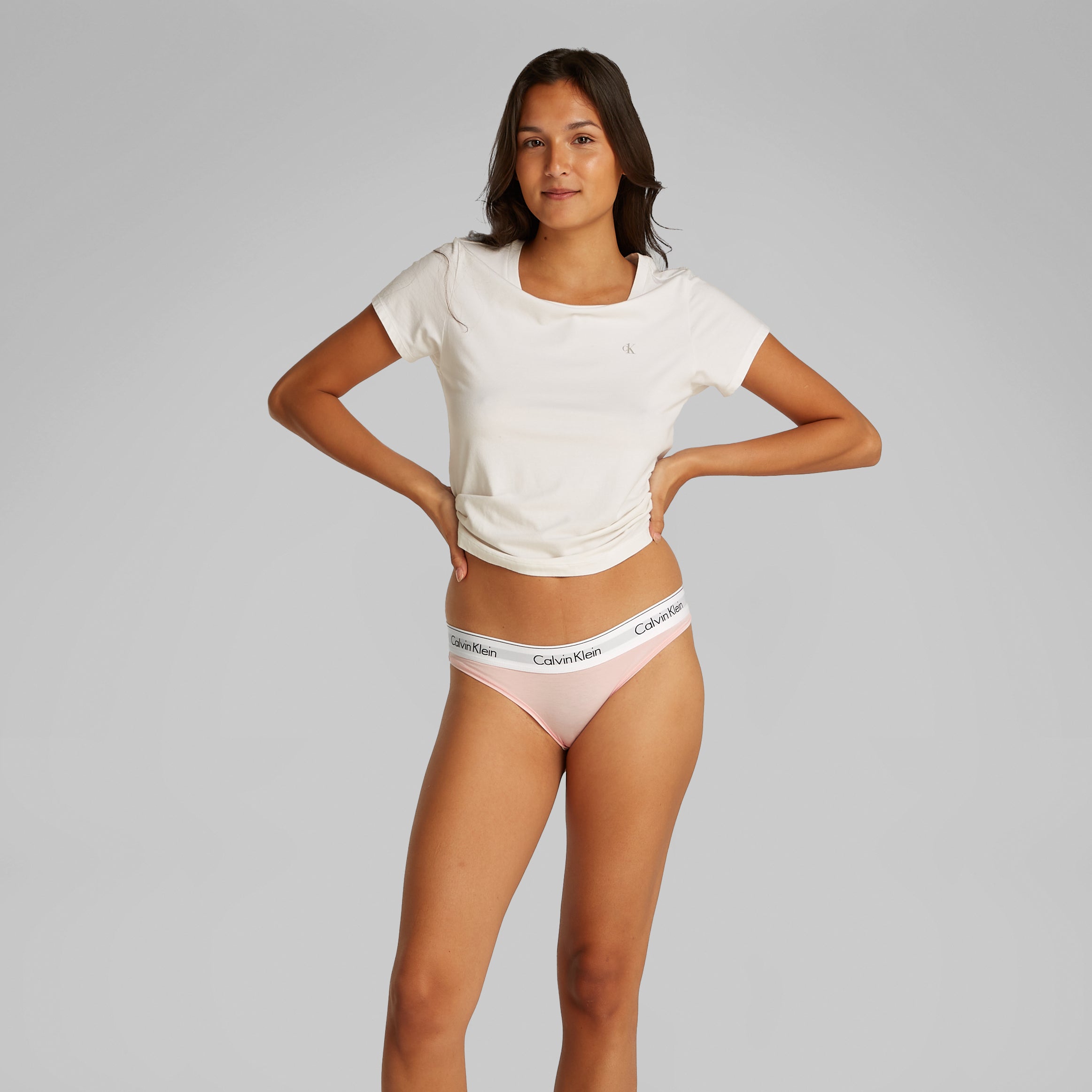 Calvin Klein ICON Cotton Modal Womens Bikini Briefs Womens Buff Pink front view on model wearing t-shirt, showcasing CK branded waistband