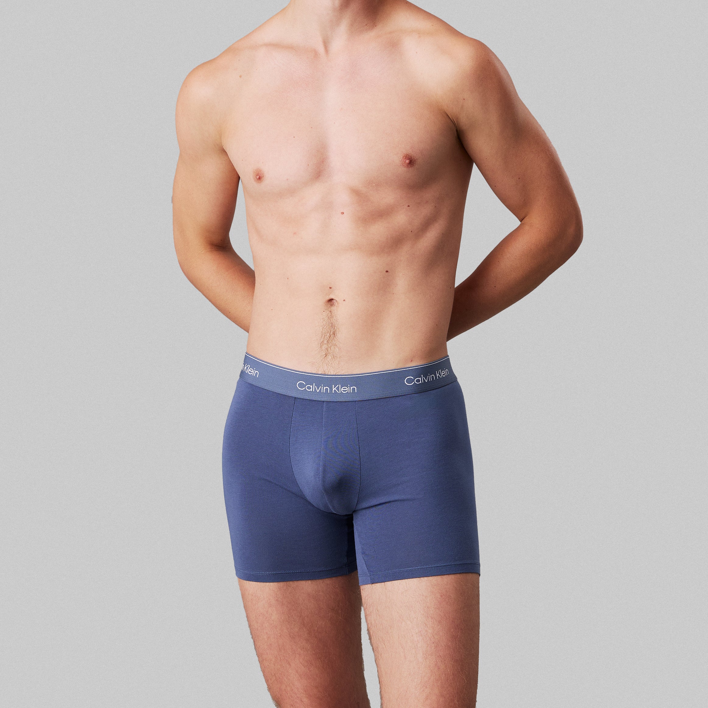 Calvin Klein ICON COTTON STRETCH Mens 3 Pack Boxer Briefs Multicoloured side view on a model, showcasing the CK elastic waistband.