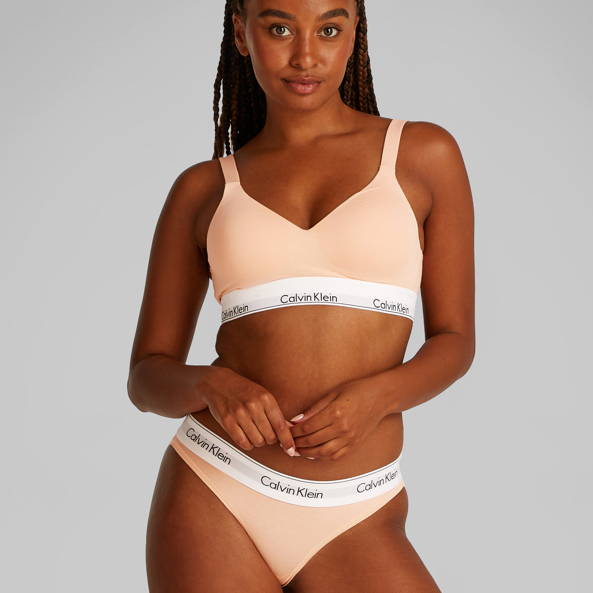 Calvin Klein ICON Cotton Modal Womens Bikini Briefs Melon Frenzy front view on model showcasing medium rise with signature waistband.