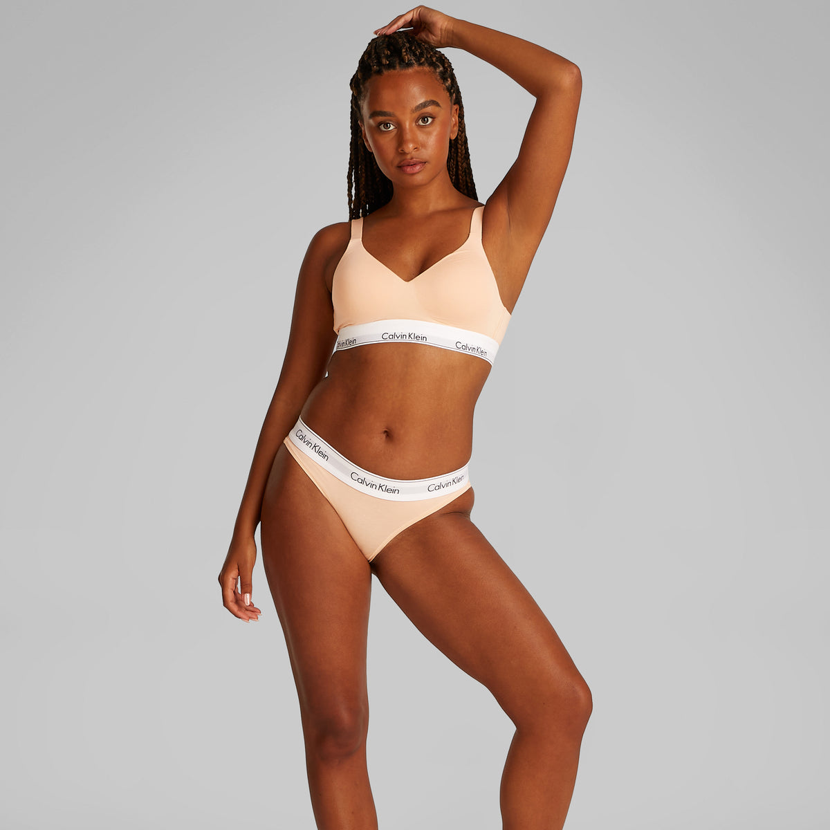 Calvin Klein ICON Cotton Modal Womens Bikini Briefs Melon Frenzy side view on model showcasing medium rise waist and elastic waistband.