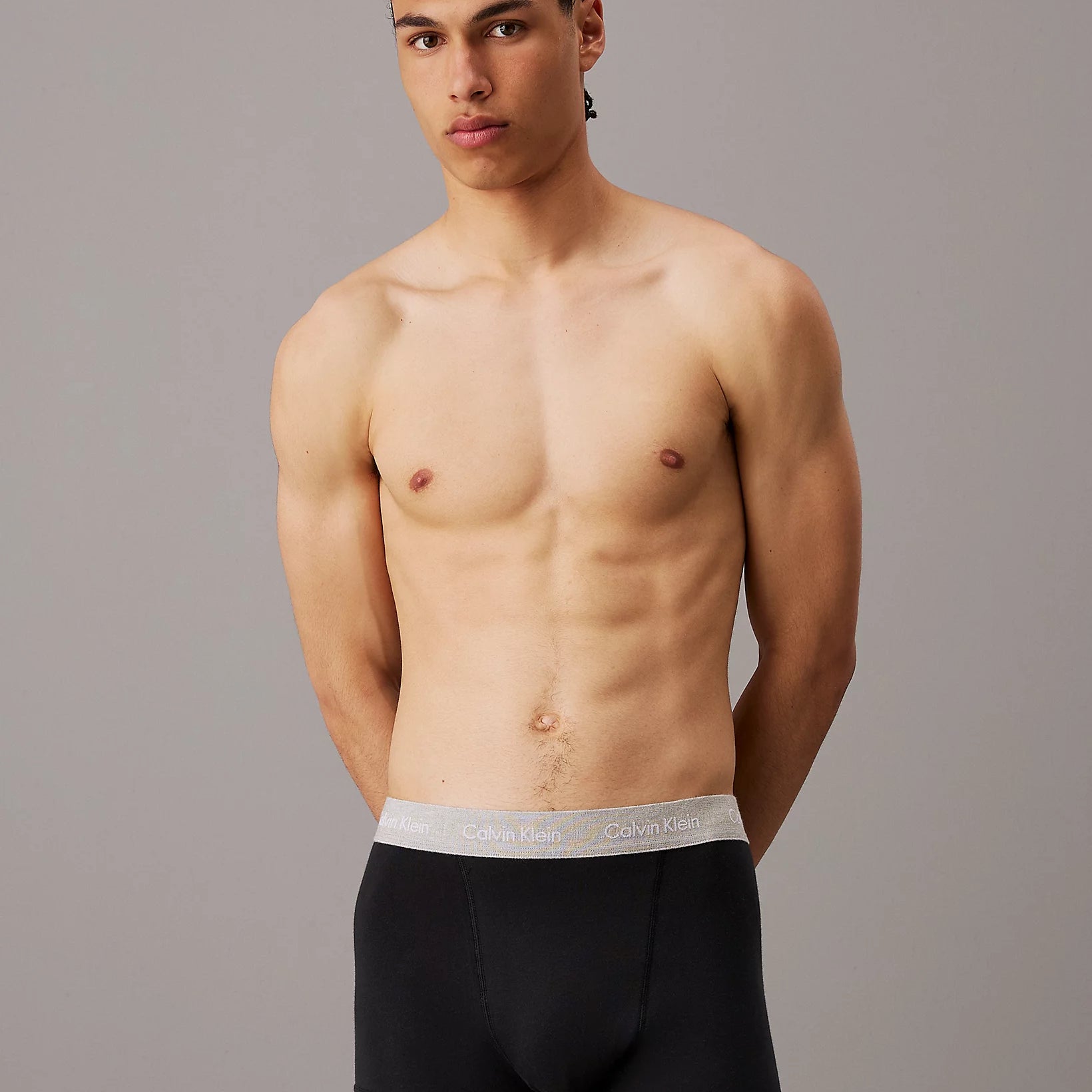 Calvin Klein COTTON STRETCH Mens 3 Pack Trunks Black model front view showcasing fit and design.