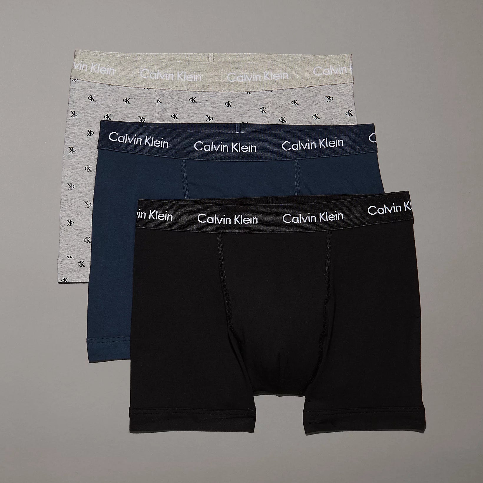 Calvin Klein COTTON STRETCH Mens 3 Pack Trunks Multicoloured, front view showcasing grey, blue, and black trunks.