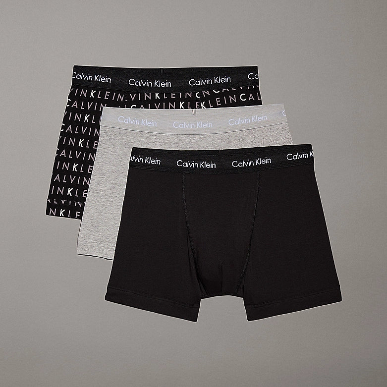 Calvin Klein COTTON STRETCH 3 Pack Mens Trunks Black Multi, front view showing three designs: black, gray, and patterned.