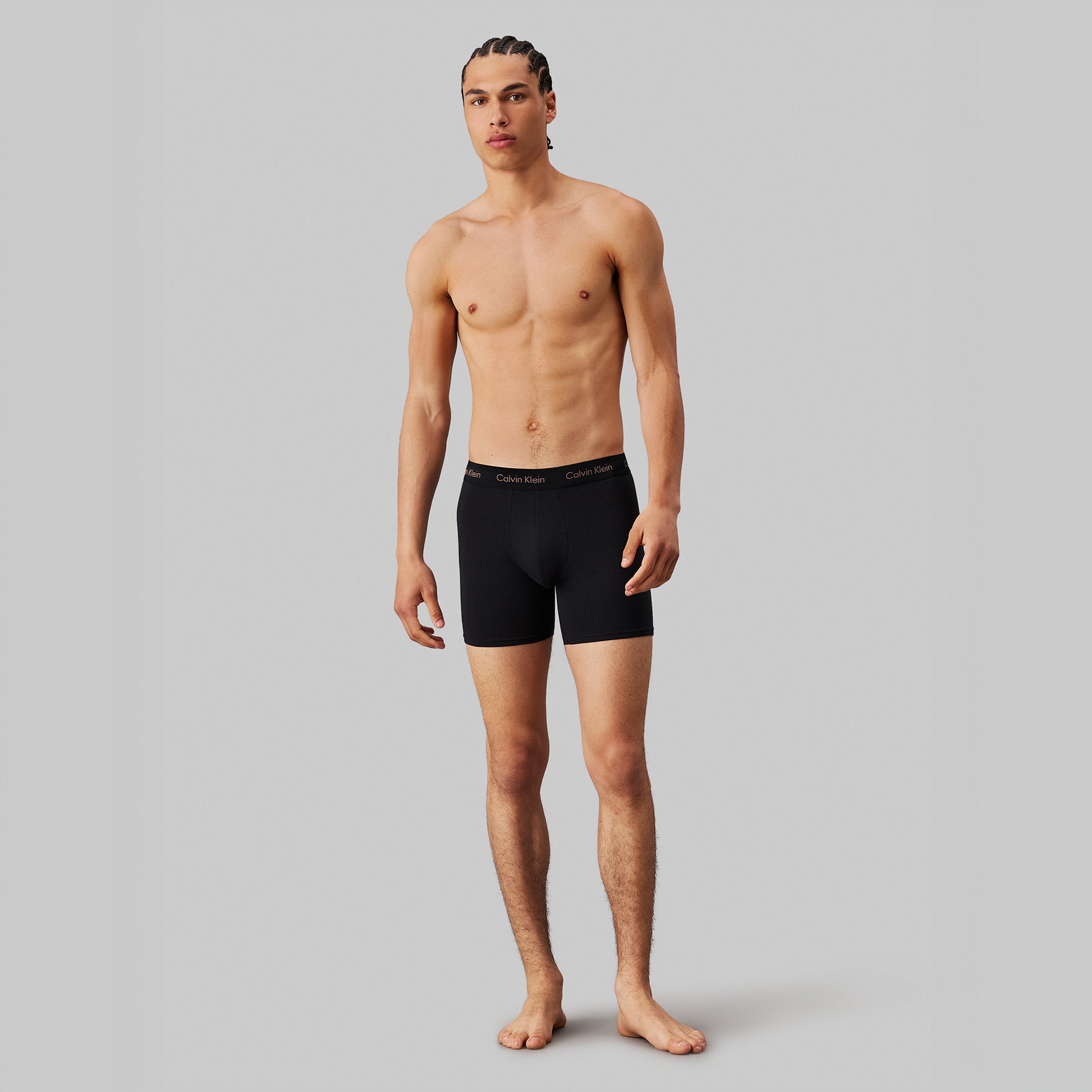 Calvin Klein COTTON STRETCH Mens 3 Pack Boxer Briefs Multicoloured side view model wearing black boxer briefs.