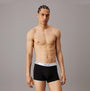 Calvin Klein MODERN COTTON STRETCH Mens 3 Pack Trunks Multicoloured front view model wearing black trunks.
