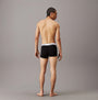 Calvin Klein MODERN COTTON STRETCH Mens 3 Pack Trunks Multicoloured, back view of model wearing black trunks.