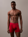 Calvin Klein MC HOLIDAY FASHION Mens 3 Pack Boxer Briefs Multicoloured front view on model, showcasing the red color and brand logo.