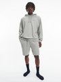 Calvin Klein MODERN COTTON TERRY LOUNGE Shorts Mens Grey Heather front view, model wearing matching grey shorts and hoodie.