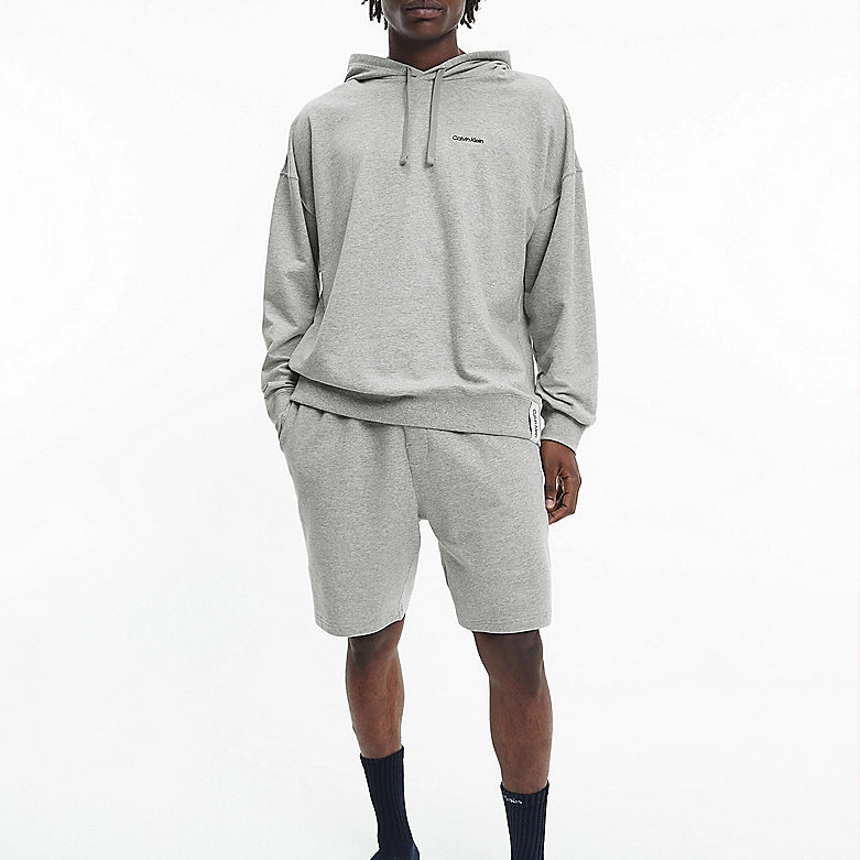 Calvin Klein MODERN COTTON TERRY LOUNGE Shorts Mens Grey Heather front view, model wearing matching grey shorts and hoodie.